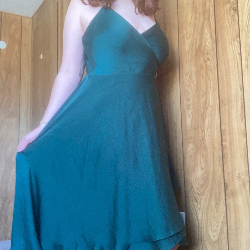 Green show po formal dress with ruffles at the bottom
